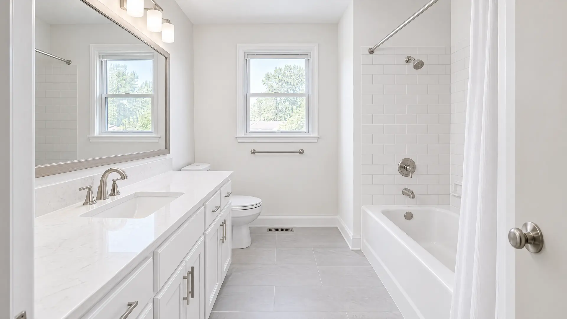 Illustration of the same bathroom after a refresh, with a painted vanity, quartz top, reglazed tub and subway tile
